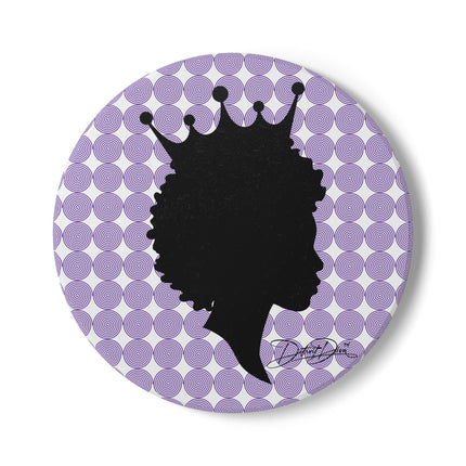 Round coaster with black silhouette of a woman with a crown on a purple and white circular patterned background.