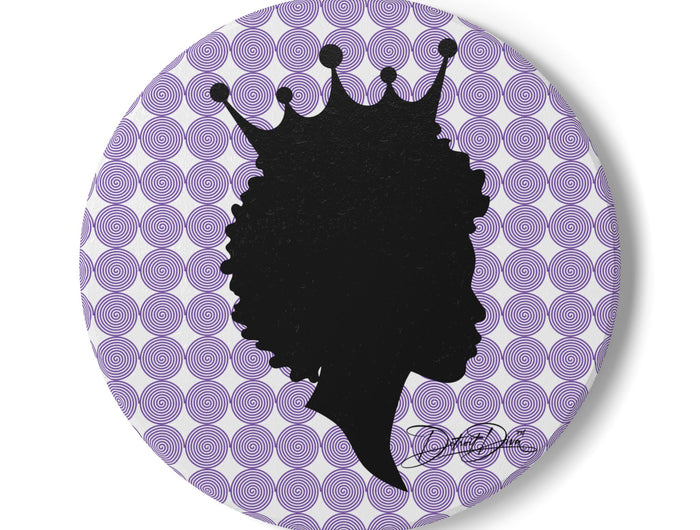 Round coaster with black silhouette of a woman with a crown on a purple and white circular patterned background.