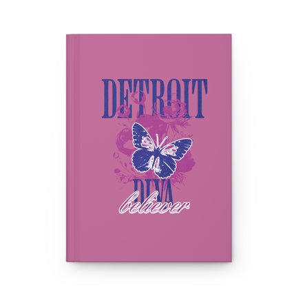 Pink journal or notebook with butterfly design and text on a white background