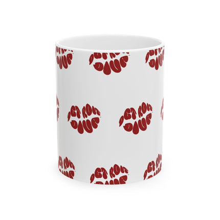 White mug with red lips print pattern on a white background