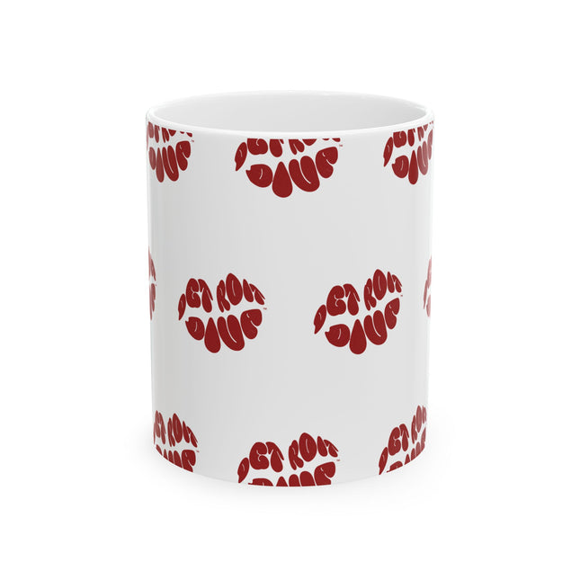 White mug with red lips print pattern on a white background