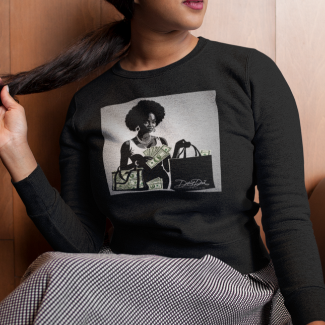 Person wearing a black sweatshirt with a graphic design of a woman holding a purse.