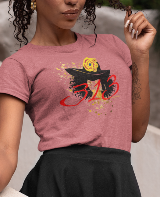 Woman wearing a pink t-shirt with a graphic design of a church hat and the area code 313.