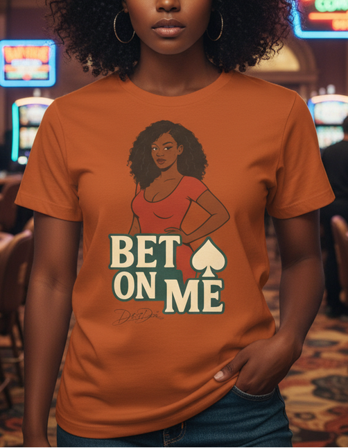 Woman wearing an orange t-shirt with a graphic and text in a casino setting