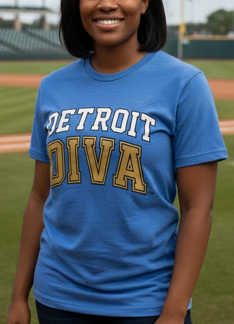 Woman wearing a blue 'Detroit Diva' t-shirt on a baseball field
