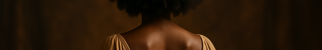 black woman from the back with an afro wearing a crown
