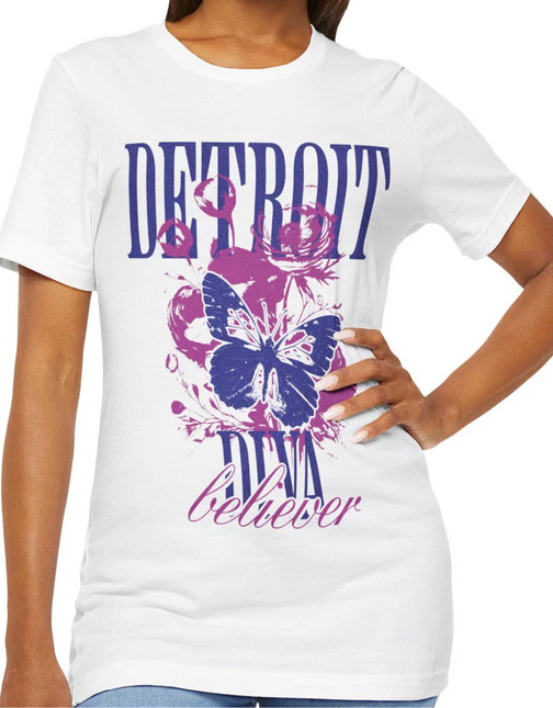 White t-shirt with purple butterfly graphic and 'Detroit Diva Believer' text on a white background